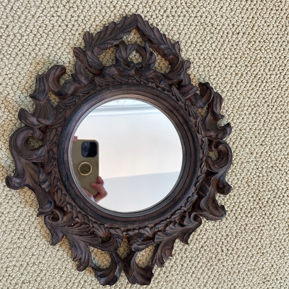 Ornate bronze mirror